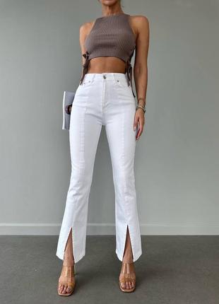 Белые джинсы с разрезами2 фото