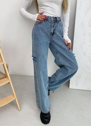Расклешенные джинсы с рваной отделкой3 фото