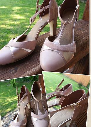 Фирменные стильные качественные натуральные кожаные босоножки на каблуке.