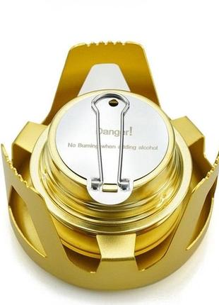 Спиртовий пальник золотого кольору