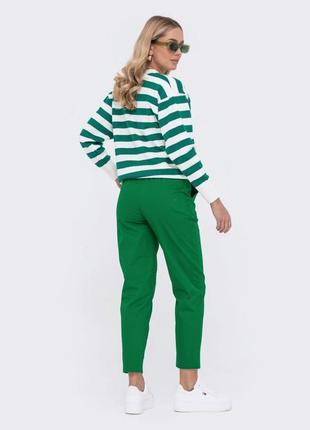 Бавовняні зелені штани звуженого крою2 фото