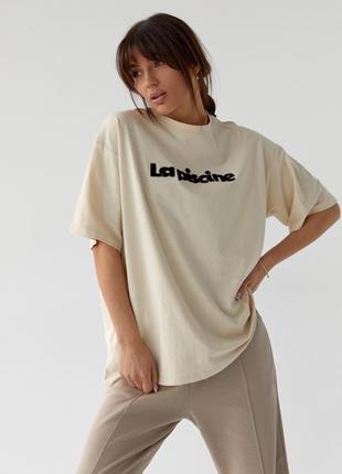 Жіноча футболка з написом la piscine кремовий1 фото