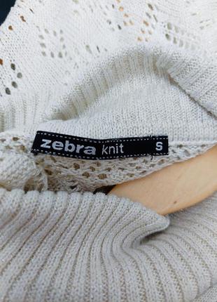 Женский бежевый вязаный свитер с блестками, по низу приталенная без рукавов с воротником от бренда zebra2 фото