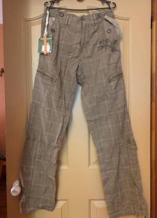 Распродажа! новые брюки итальянской фирмы с множеством карманов.