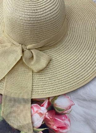Женская широкополая шляпа с полями 15 см и бантом бежевая7 фото