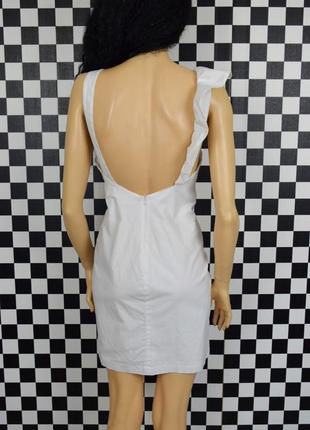 Белоснежное котоновое белое ассиметричное мини платье с воланом3 фото