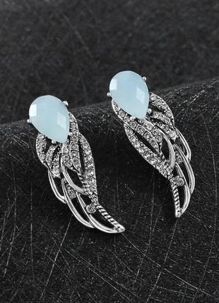 Серьги женские (бижутерия) крылья ангела oxa с голубым камнем серебристые