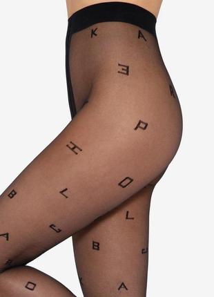 Оригинальные фантазийные колготки с узором буквы в телесном и черном цвете