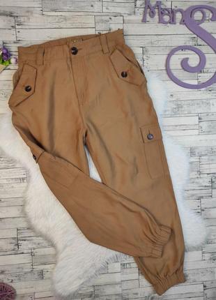 Женские брюки amisu коричневого цвета с манжетами и с карманами размер 38 46 м
