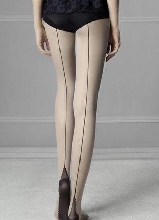Матовое колготки декорированы швом - стрелкой сзади по всей длине ноги
