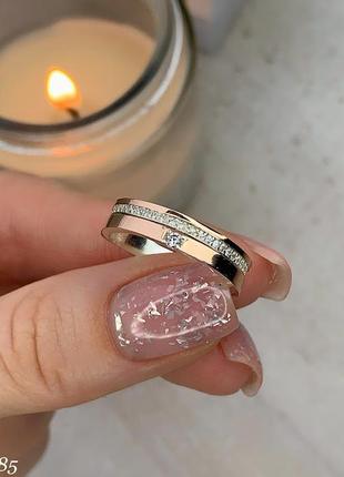 Серебряное кольцо с золотыми накладками и камнями