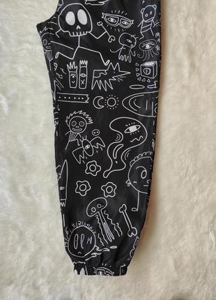 Чорні спортивні штани з принтом написами з гумкою манжетами плащівка батал великого розміру10 фото