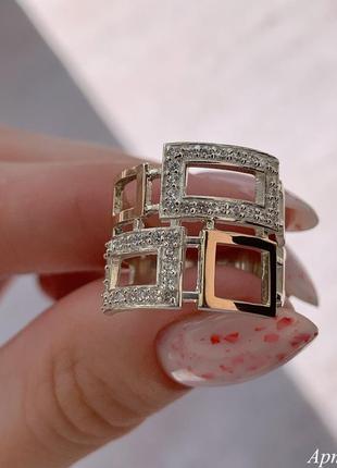 Серебряное кольцо с золотыми накладками и камнями