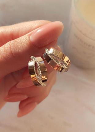 Срібні сережки з золотими накладками та камінням