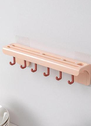Настенный держатель-органайзер для ножей с крючками розовый1 фото