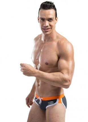 Черные плавки с оранжевой резинкой desmit