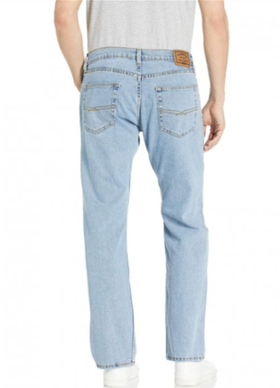 Блакитні оригінальні джинси на середній зріст