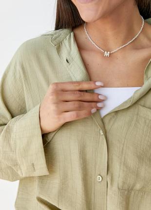 Женская рубашка с полукруглым низом и жатой текстурой3 фото