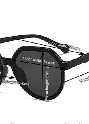 Сонцезахисні окуляри круглої форми в чорній оправі.5 фото