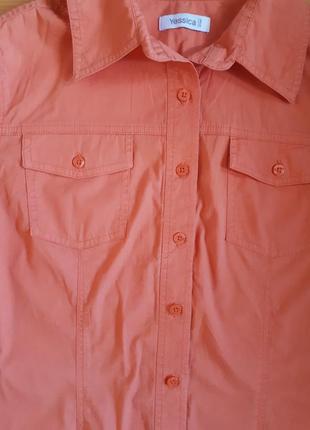 Рубашка оранжевого цвета с коротким рукавом3 фото