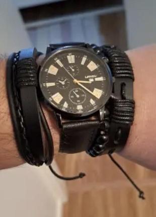Подарунковий набір для чоловіків: наручний годинник з 3 стильними браслетами - діам. 4 см, довж. 24 см, шир рем 2 см, без коробки.2 фото