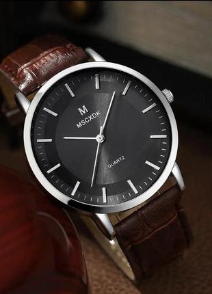 Подарунковий набір для чоловіків: наручний годинник з 4 стильними браслетами - діам. 4 см, довж. 24 см, шир рем 2 см, без коробки.6 фото