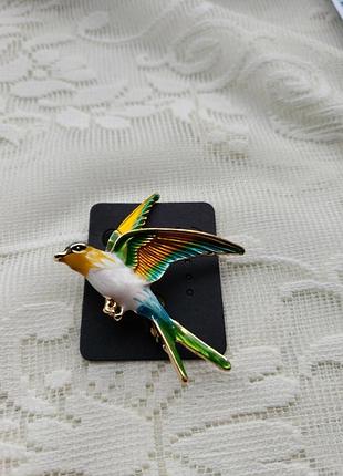 Брошка у вигляді птаха