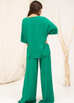 Зеленый льняной костюм с широкими брюками3 фото