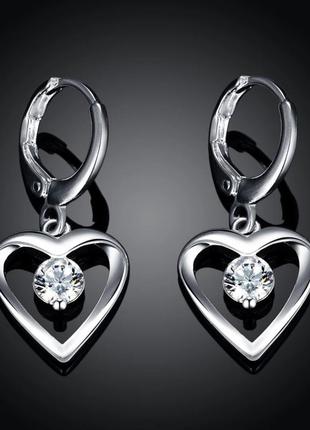 Жіночі сережки "серце у срібній ніжності" ювелірний сплав та циркони - оригінальний подарунок дівчині1 фото