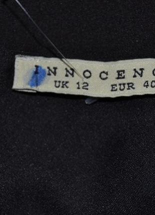 Длинная блузка с разрезом на спинке