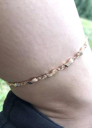 Оригінальний подарунок дівчині - ніжний браслет на ногу "золота хвиля з підвісками" ювелірний сплав7 фото