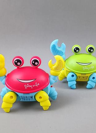 Музична іграшка крабик арт. 776-5 3 кольори світло звук пакет. 24*9*20 см краб