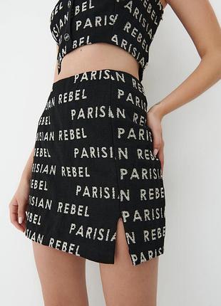 Міні спідниця з розрізом картата принтована