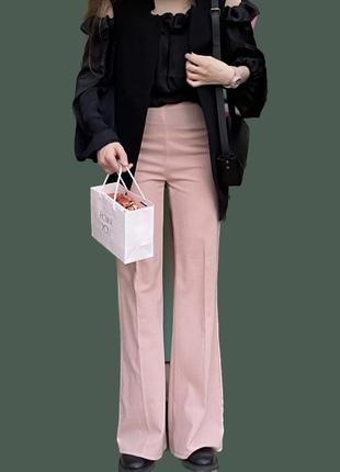 Брюки кльош рожеві