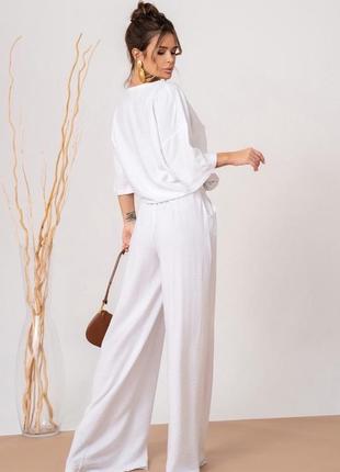 Білий лляний костюм із широкими брюками3 фото