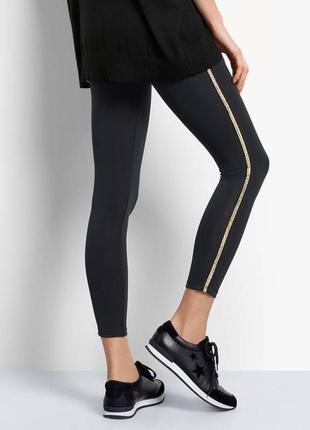 Леггинсы оригинал hush black gold side stripe leggings1 фото