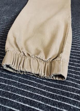 Женские фирменные телесные джинсы-джоггеры высокой посадки6 фото