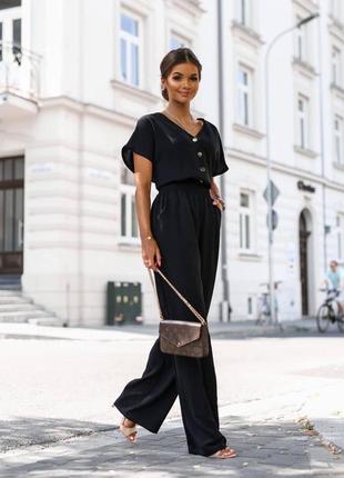 Комбинезон женский черный однотонный на пуговицах с карманами брюки свободного кроя качественный стильный3 фото