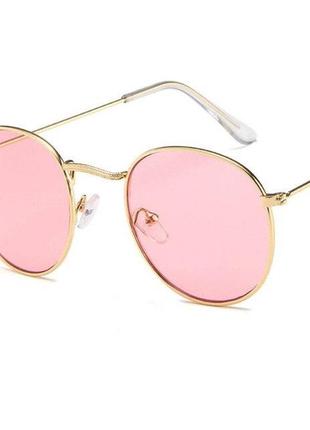 Круглі сонцезахисні окуляри у золотистій оправі з рожевою лінзою1 фото
