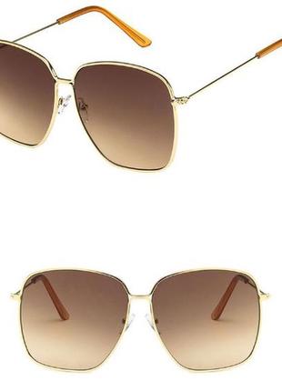 Крупные квадратные солнцезащитные очки с золотой оправой и линзой коричневый градиент1 фото