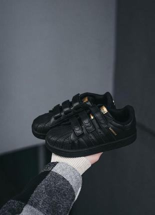Детские кроссовки adidas superstar чёрные с золотым4 фото