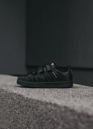 Детские кроссовки adidas superstar чёрные с золотым1 фото