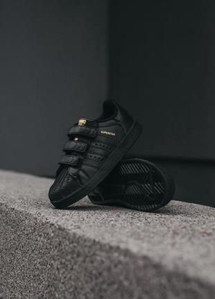 Детские кроссовки adidas superstar чёрные с золотым2 фото