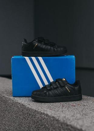 Детские кроссовки adidas superstar чёрные с золотым6 фото