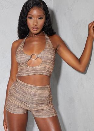 Велосипедки коричневого цвета в полосатый принт.