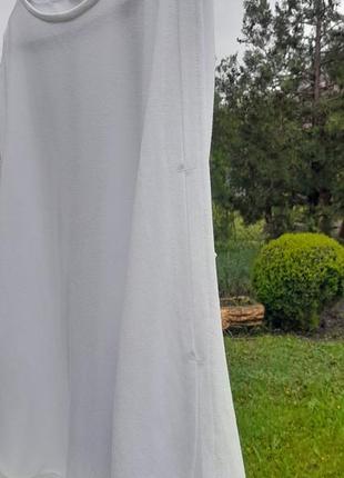 Белая трикотажная блуза с вышивкой5 фото