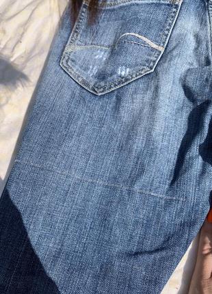 Трендовые рваные зауженые джинсы4 фото