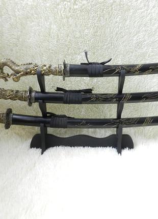 Подарунковий набір шаблі з рукояткою у вигляді дракона три одиниці декоративні на дерев'яні підставк